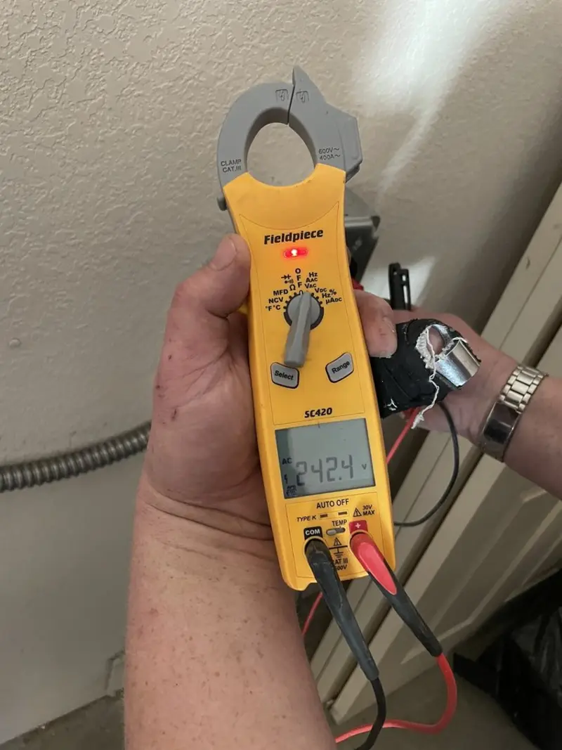 Voltage testing with clamp meter during Electrical Installation Services in Florin